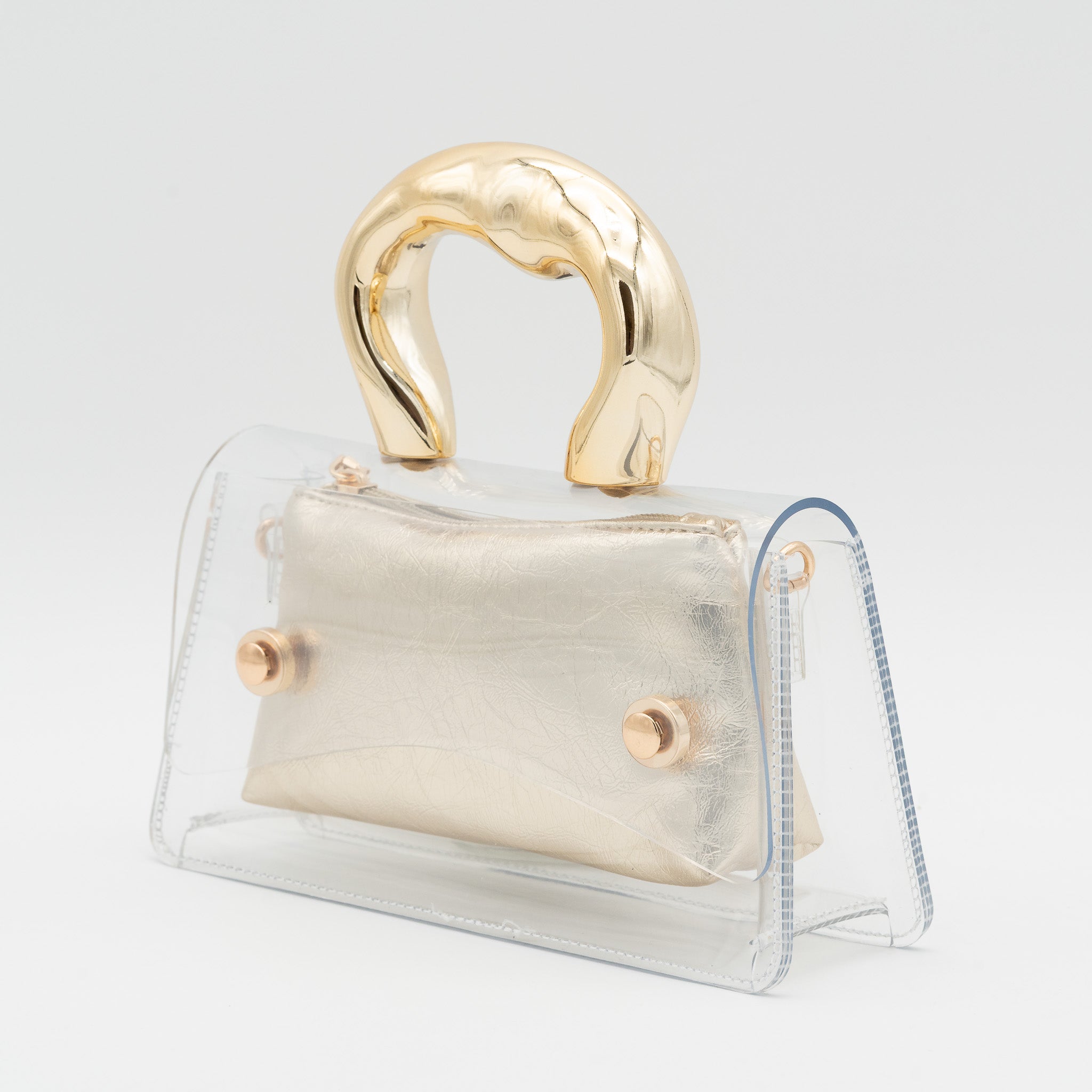 Bolso de fiesta transparente con asa efecto metálico e interior de polipiel oro con cremallera