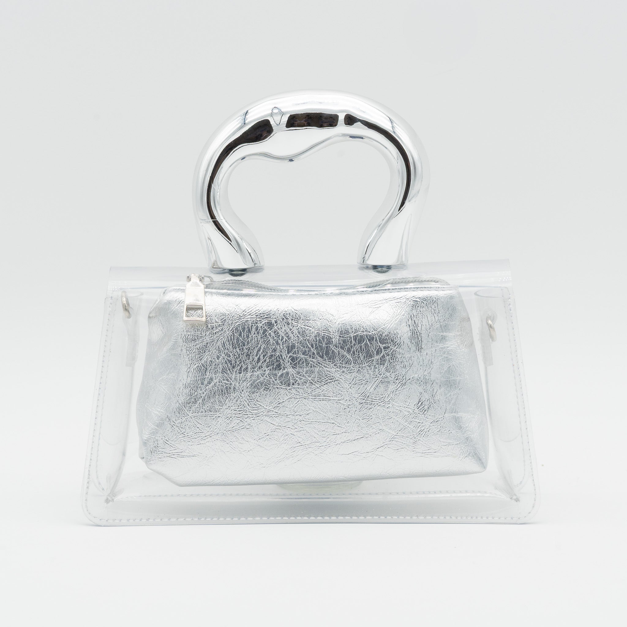 Bolso de fiesta transparente con asa efecto metálico e interior de polipiel plata con cremallera